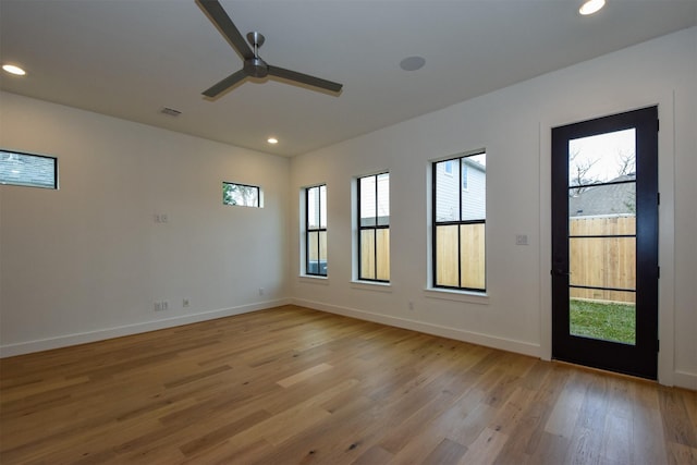 unfurnished room featuring ceiling fan and light hardwood / wood-style floors