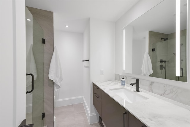 bathroom with vanity and an enclosed shower