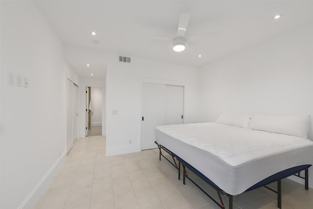 bedroom featuring ceiling fan and a closet