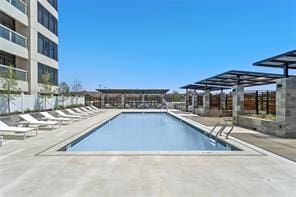 view of swimming pool with a patio area