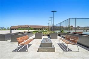 view of patio featuring a fire pit