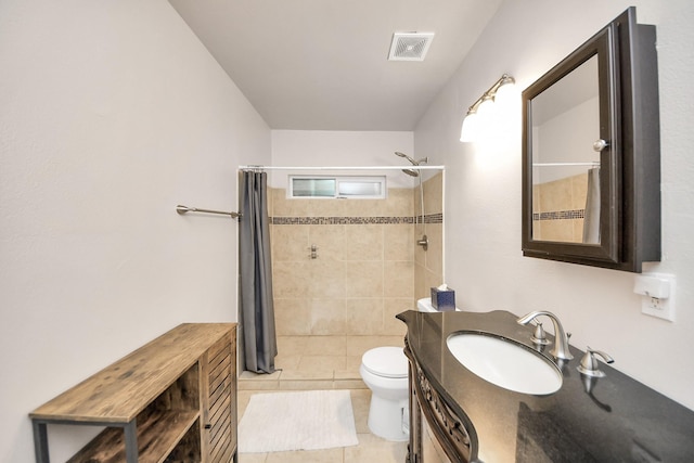 bathroom with a shower with curtain, tile patterned floors, toilet, and vanity