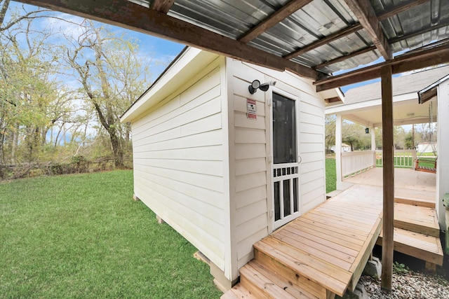 wooden deck featuring a lawn