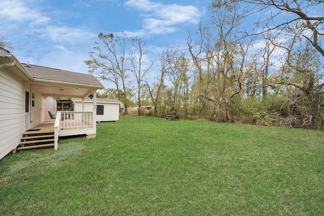 view of yard featuring a wooden deck