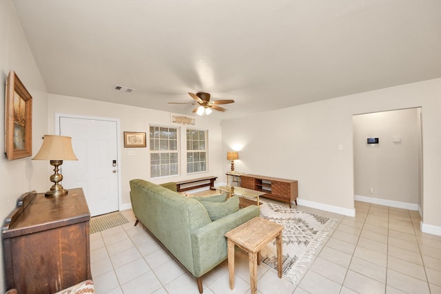 living room with ceiling fan and light tile patterned floors