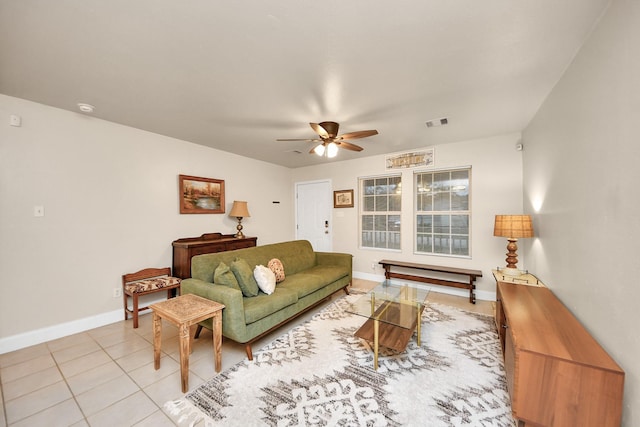 living room with light tile patterned floors and ceiling fan