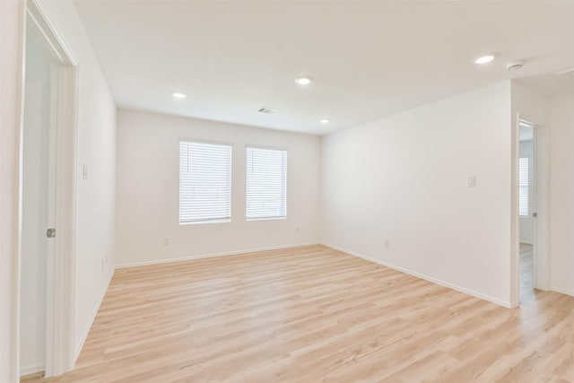 empty room with light hardwood / wood-style floors