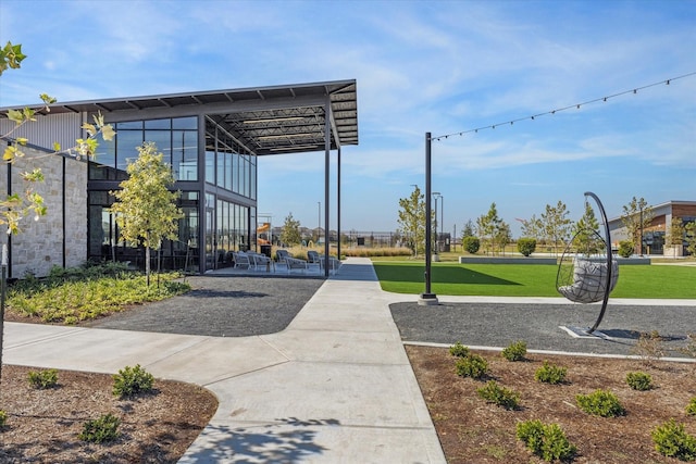 view of property's community with a lawn