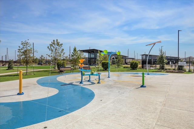 view of playground with a lawn