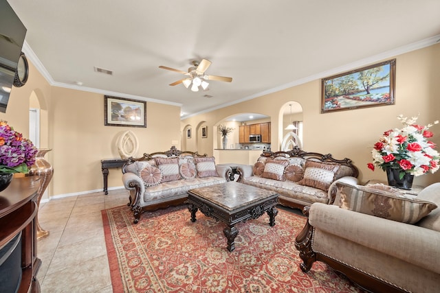 tiled living room featuring ceiling fan and ornamental molding