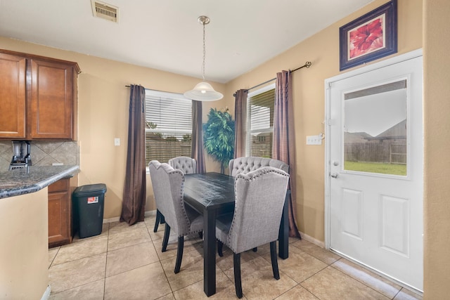 dining room featuring light tile patterned flooring