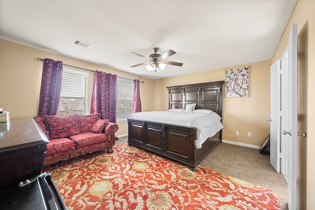 bedroom featuring ceiling fan and light colored carpet