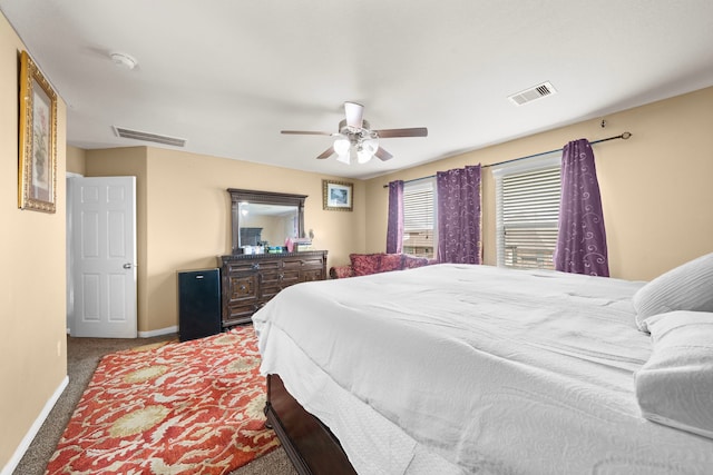 bedroom with ceiling fan and carpet floors