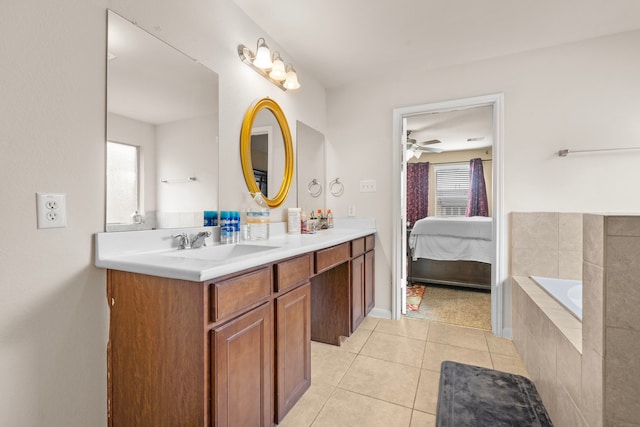 bathroom with vanity, tiled bath, tile patterned floors, and ceiling fan