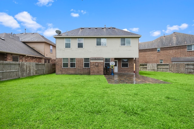 back of house with a yard