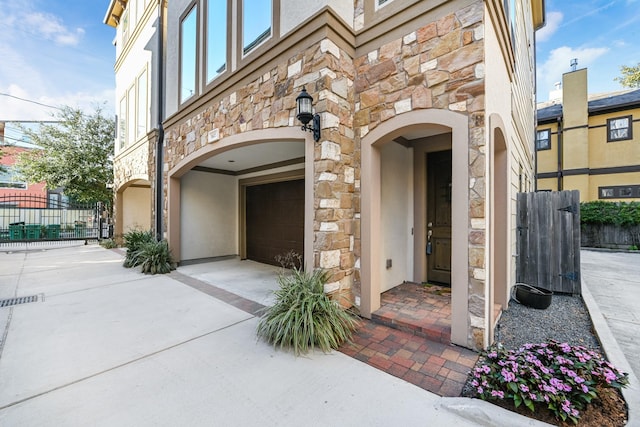 view of exterior entry featuring a garage