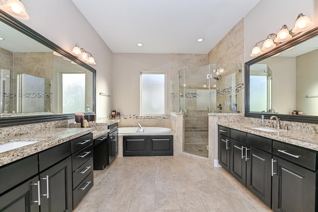 bathroom featuring tile patterned floors, vanity, and separate shower and tub