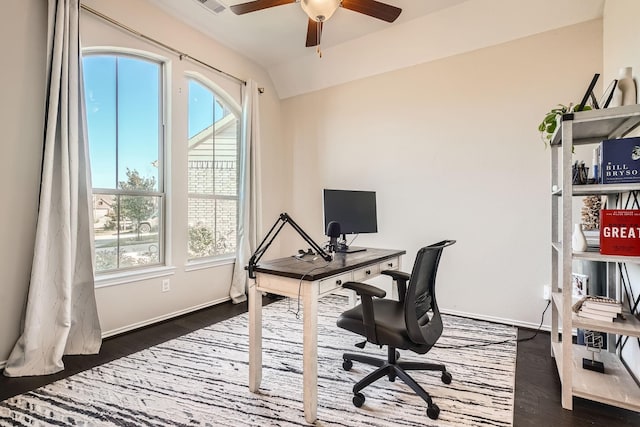 home office featuring dark wood-type flooring, ceiling fan, and lofted ceiling