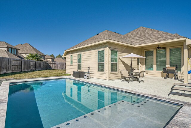 view of pool with a patio area and ceiling fan