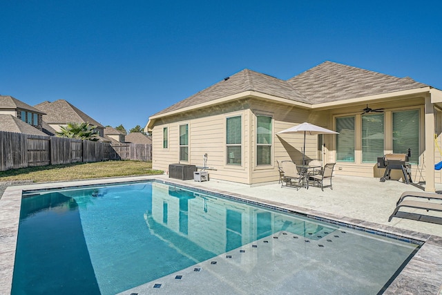 view of pool with a patio and ceiling fan