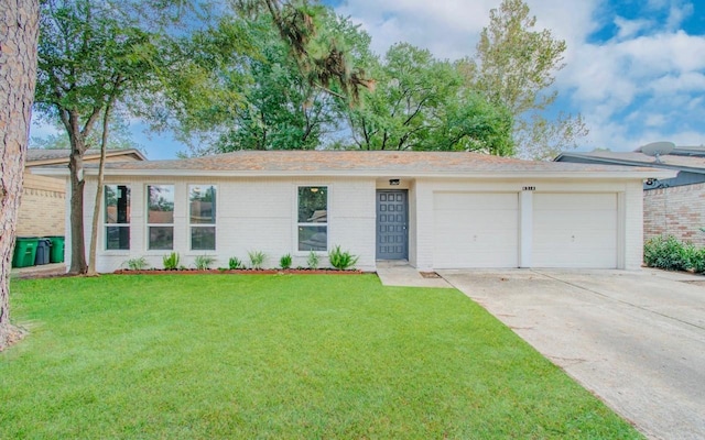 ranch-style house with a garage and a front yard