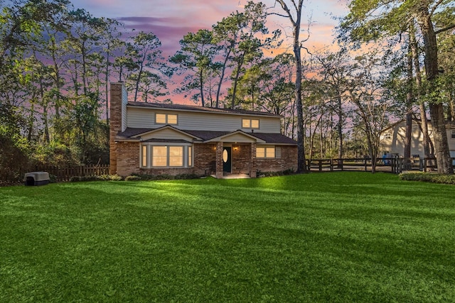 view of front property with a lawn