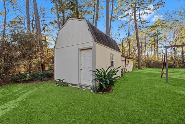 view of outbuilding featuring a lawn