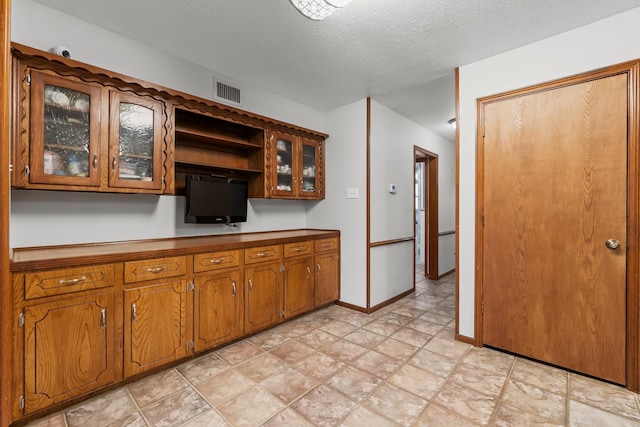 kitchen with a textured ceiling