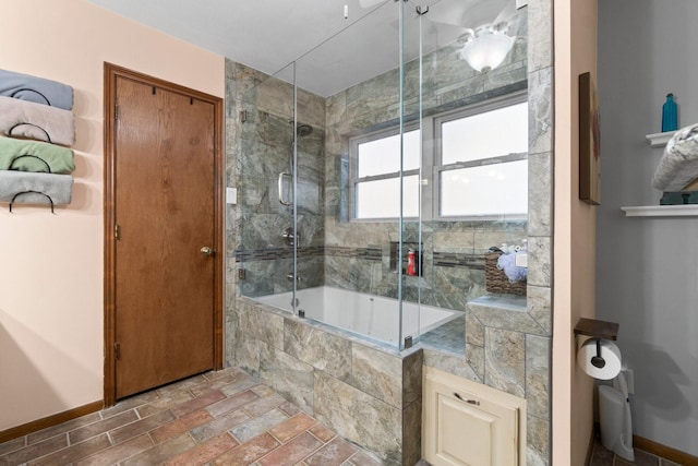 bathroom with shower / bath combination with glass door