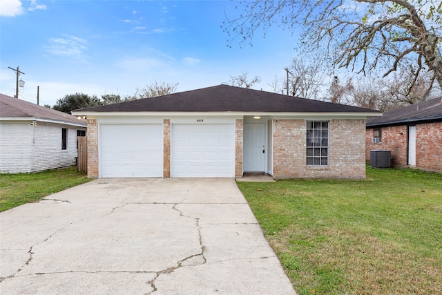 ranch-style house featuring a front lawn, cooling unit, and a garage