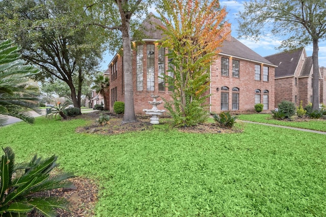 view of property exterior with a lawn