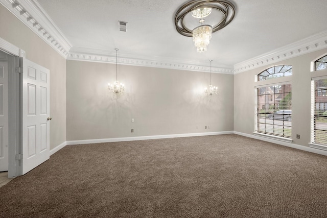 carpeted empty room with a notable chandelier and crown molding