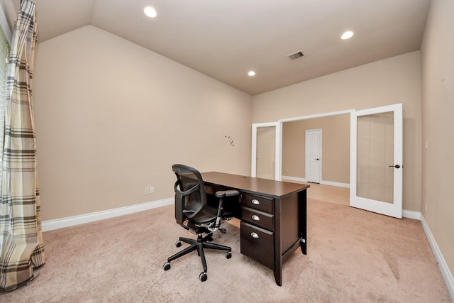 office featuring french doors, light colored carpet, and lofted ceiling