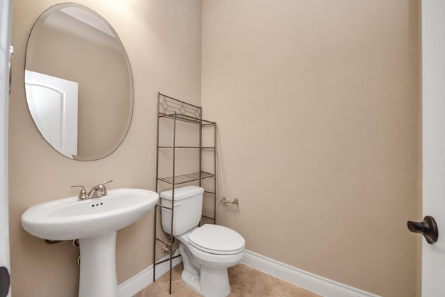 bathroom with tile patterned floors and toilet