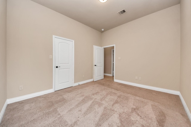 unfurnished room featuring carpet floors