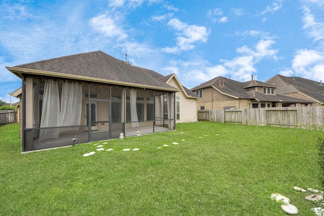 rear view of house with a lawn