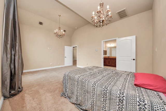 bedroom with carpet floors, vaulted ceiling, a notable chandelier, and connected bathroom