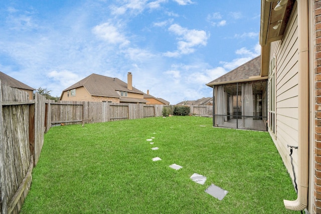 view of yard with a sunroom