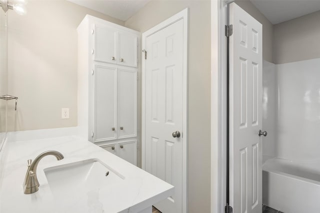 bathroom with vanity and shower / bathtub combination