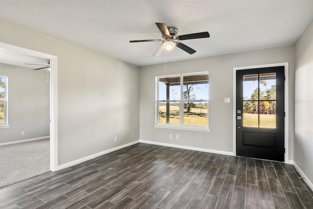 foyer entrance featuring a textured ceiling