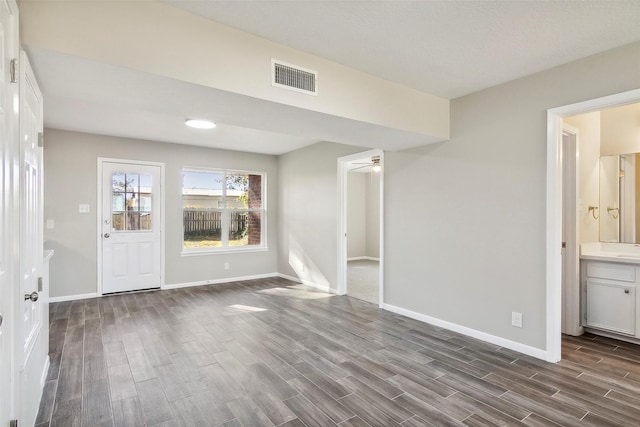 spare room with hardwood / wood-style floors and ceiling fan