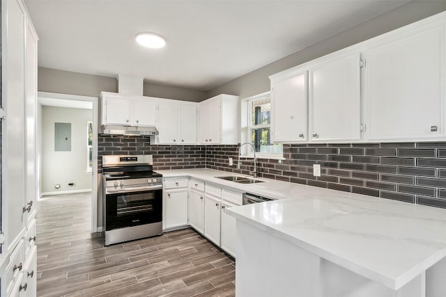 kitchen with white cabinetry, sink, and stainless steel range oven