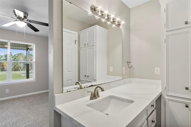 bathroom featuring ceiling fan and vanity