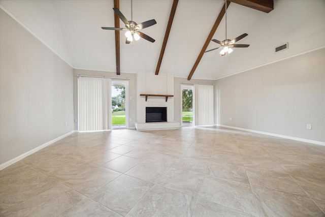 unfurnished living room featuring ceiling fan, a healthy amount of sunlight, and high vaulted ceiling