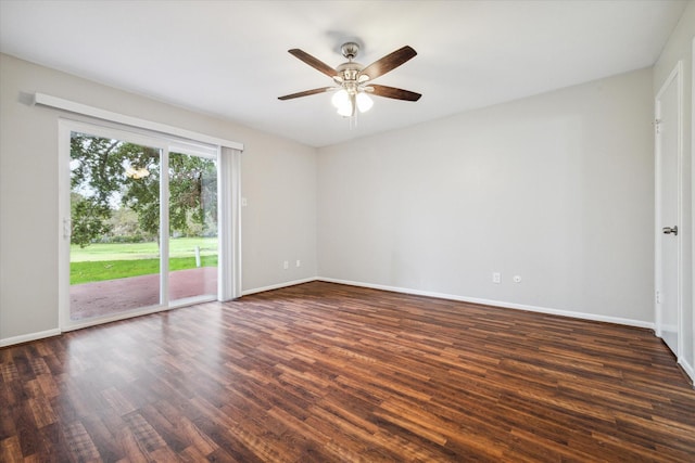 spare room featuring ceiling fan and dark hardwood / wood-style flooring