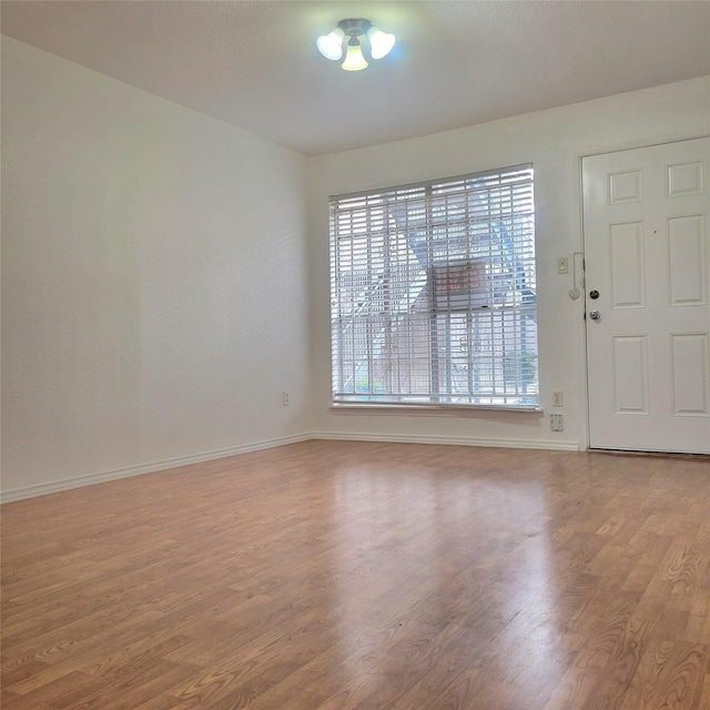 foyer entrance with light hardwood / wood-style floors