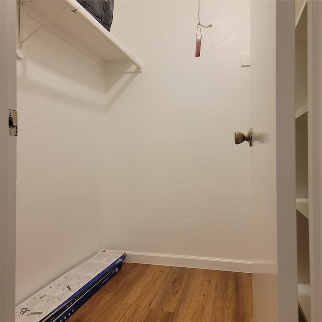 walk in closet featuring hardwood / wood-style flooring