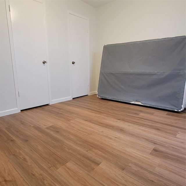 unfurnished bedroom with light hardwood / wood-style flooring