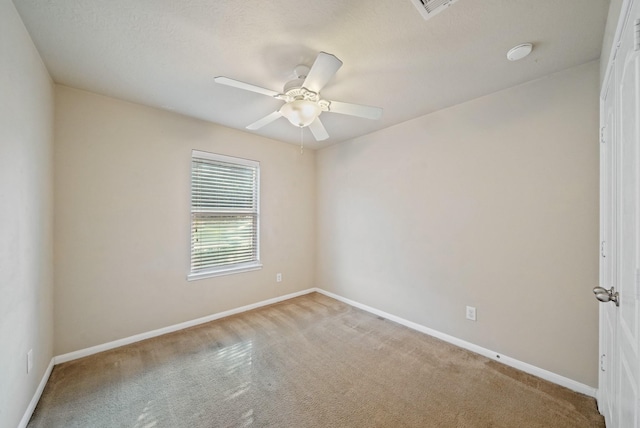 empty room featuring ceiling fan