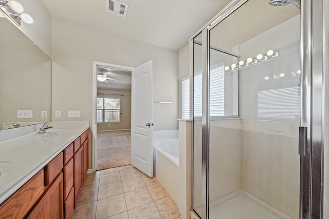 bathroom featuring tile patterned floors, ceiling fan, vanity, and independent shower and bath